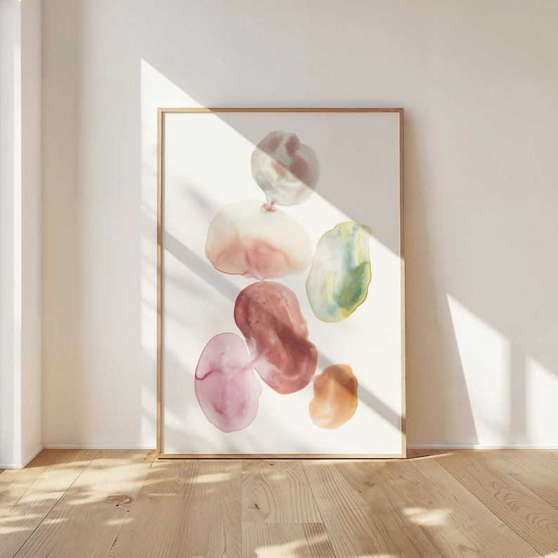 Pode incluir: Impress&atilde;o de arte abstrata com um grupo de formas org&acirc;nicas coloridas em tons de rosa, vermelho, verde e marrom. As formas lembram gotas de &aacute;gua ou seixos, criando uma est&eacute;tica visualmente atraente e moderna.