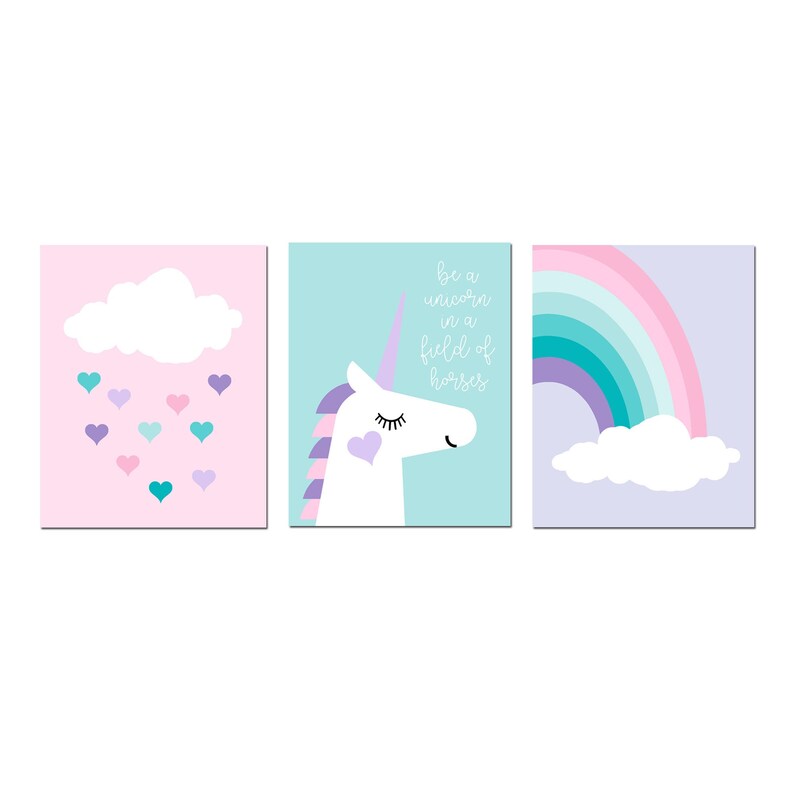May include: Three framed art prints with a whimsical theme. One features a cloud with falling hearts, another a unicorn with text that reads "be a unicorn in a field of horses", and the last a rainbow.