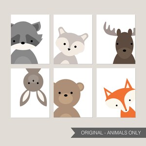 May include: Set of six printable nursery art prints featuring cute cartoon animals. The animals include a raccoon, fox, moose, bunny, bear, and fox. The prints are in a minimalist style with white backgrounds and simple outlines.