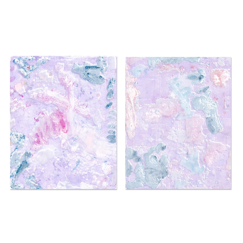 May include: Two abstract paintings with a purple background and white, pink, and blue paint splatters.