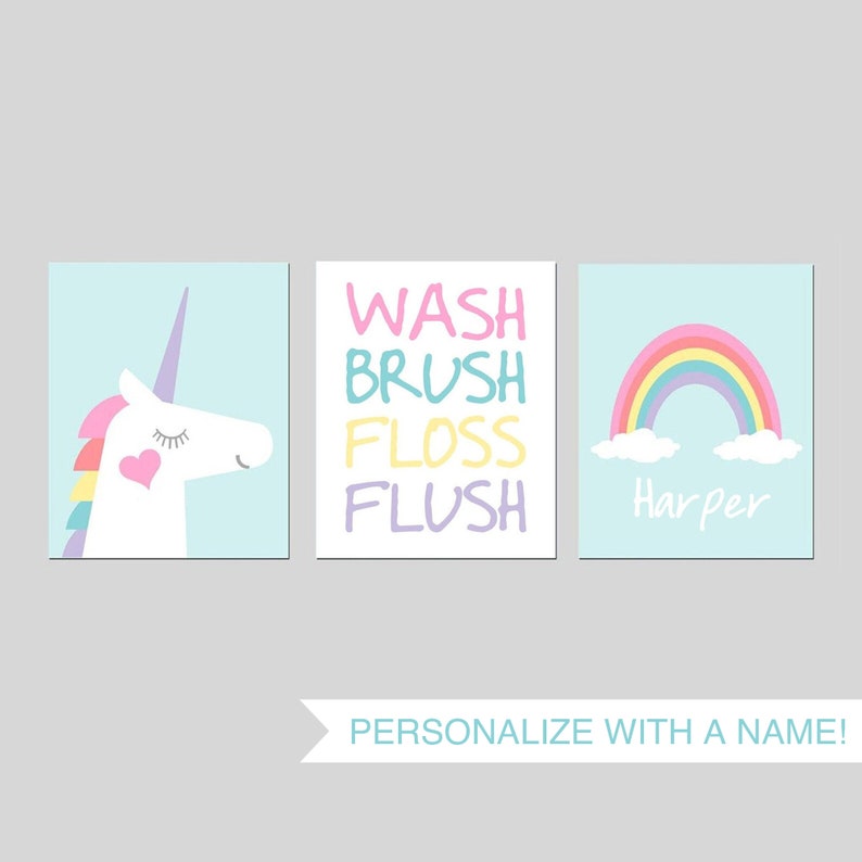 May include: Three bathroom wall art prints with a unicorn, rainbow, and the words "Wash, Brush, Floss, Flush". The rainbow print is personalized with the name "Harper".