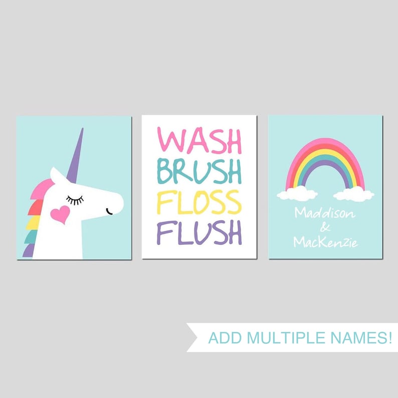 May include: Three bathroom wall art prints with a unicorn, rainbow, and the words "Wash, Brush, Floss, Flush". The rainbow print has the names "Maddison & Mackenzie" written below it.