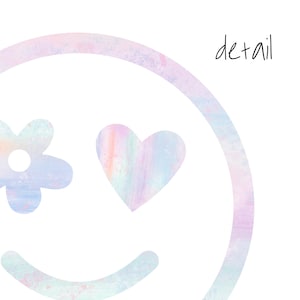 May include: A pastel rainbow colored smiley face with a flower and a heart. The background is a light pink and blue watercolor wash.