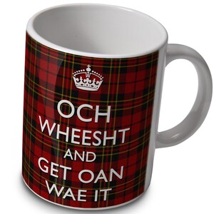 May include: White ceramic mug with a red and black tartan pattern. The mug has a crown and the text "Och Wheesht and Get Oan Wae It" printed on it.