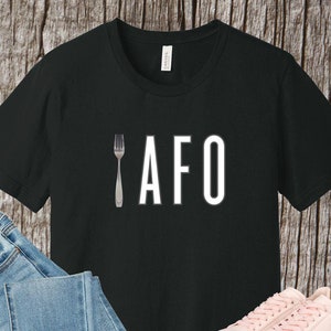 May include: Black t-shirt with a white fork and the text "AFO" printed on the front.
