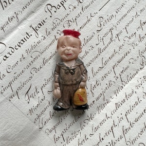 Vintage Celluloid Doll- Boy in Sailor Suit Holding Bird Cage- Impish Grin
