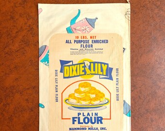 Dixie Lily 10# Flour Sack Unused cotton, still stitched, front & back paper labels 17.5" x 10" pink, gray and turquoise blue kitchen tools