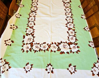 Nappe gardénia 50 x 64 po. fleurs blanches avec feuilles brunes, large bordure vert menthe, coton blanc épais V Bon à excellent vintage