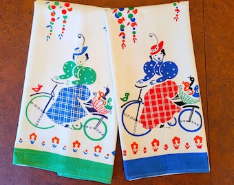 2 Broderie Tea or Dish towels, Girls on Bicycles with Birds & Flowers, vivid colors on heavy white cotton Excellent unused vintage condition