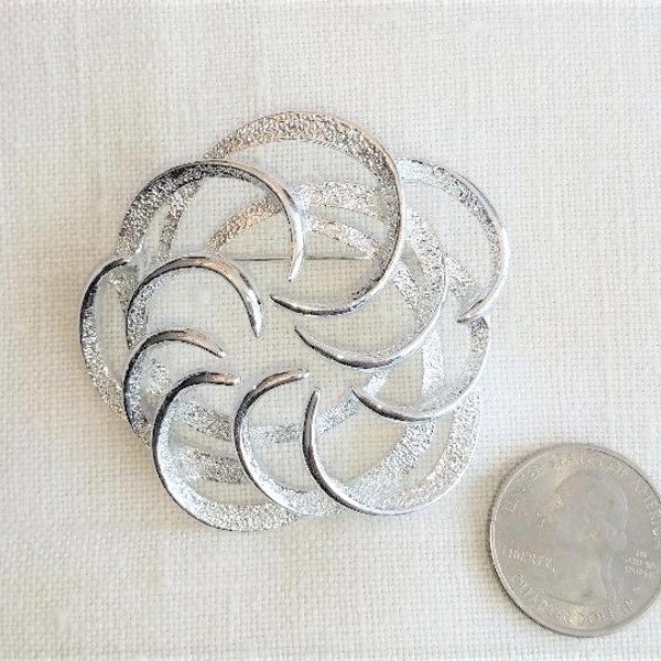 NOS Sarah Coventry Tailored Swirl silvertone brooch pin, MCM classic style, new old stock! 2.25" across.  Excellent vintage condition