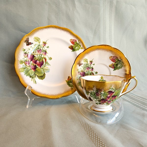 Queen Anne Strawberries Trio teacup, saucer, and 8 3/8" plate with wide brushed gold trim, Bone China England, Excellent vintage condition