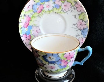 Hand painted floral teacup & saucer, blue handle, gold trim, pastel flowers F14521 Crown Staffordshire Bone China England Excel vintage cond