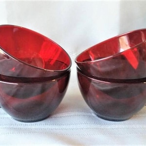 May include: A set of three ceramic mugs with a speckled, matte finish. The mugs are in shades of cream, light gray, and dark gray. Each mug has a simple, minimalist design, perfect for coffee or tea.