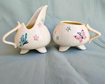 Hull Butterfly Creamer & open sugar bowl, pink and blue flowers and butterflies on white spatter glaze, MCM pottery Exc vintage condition