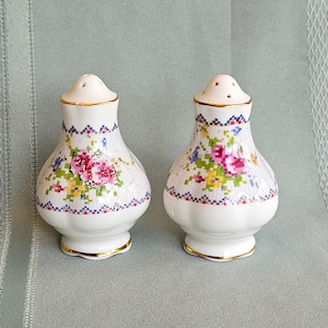 Royal Albert Petit Point salt and pepper shakers, pink yellow blue with pink roses, gold trim, bone china England, VGood to Exc vintage cond
