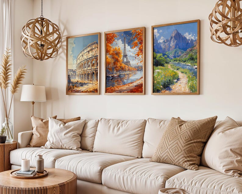 May include: Three framed art prints depicting famous landmarks. The first print shows the Colosseum in Rome, the second print shows the Eiffel Tower in Paris, and the third print shows a mountain range with a river flowing through it.