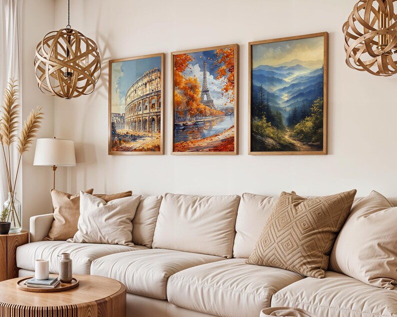 May include: Three framed art prints hanging on a white wall. The prints feature a scenic view of the Eiffel Tower in Paris, a view of the Colosseum in Rome, and a mountain landscape.