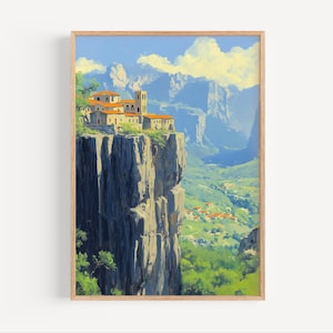 May include: A framed landscape painting depicts a village perched atop a towering cliff. The artwork features buildings with terracotta roofs, set against a backdrop of mountains, a valley, and a bright blue sky with fluffy clouds. The painting is in a wooden frame.