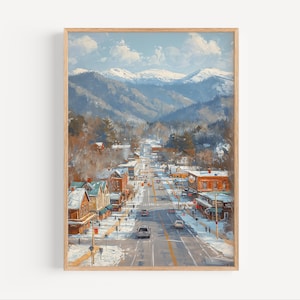 Könnte beinhalten: Ein Gemälde einer schneebedeckten Bergstadt mit einer Straße, die von Gebäuden und Autos gesäumt ist. Die Berge im Hintergrund sind schneebedeckt und der Himmel ist blau mit weißen Wolken.