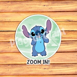 May include: A round sticker featuring the character Stitch from Lilo & Stitch. Stitch is blue with large black eyes and purple ears, smiling and holding his face. The background is a light green with a beach scene. The text "ZOOM IN!" is at the bottom.