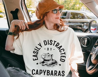 Easily Distracted By Capybaras T-Shirt: Comfort Colors Graphic Tee