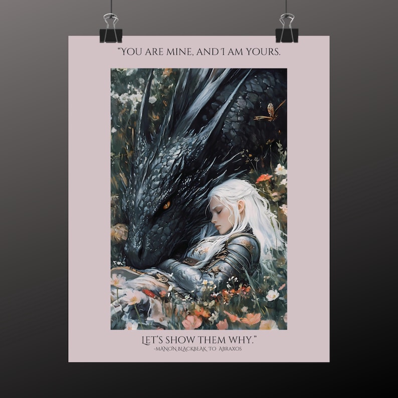 May include: A black dragon with yellow eyes is curled around a woman with long white hair. She is wearing silver armor and is asleep. The background is a field of flowers. The text "YOU ARE MINE, AND I AM YOURS. LET'S SHOW THEM WHY." is written on the image. The text "MANON BLACKBEAK TO ABRAXOS" is written below the quote.