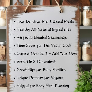 May include: A rustic wooden sign with a white background and black text. The sign lists the benefits of plant-based meals, including healthy ingredients, blended seasonings, and convenience for vegan cooks. It is a great gift for busy families.