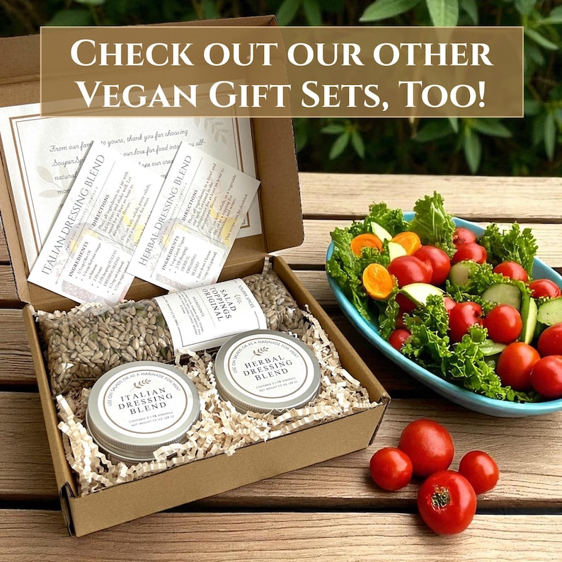 May include: A cardboard box filled with vegan gift set items, including dressing blends, salad toppings, and small metal tins. The box also contains recipe cards. The text on the image reads: "CHECK OUT OUR OTHER VEGAN GIFT SETS, TOO!"