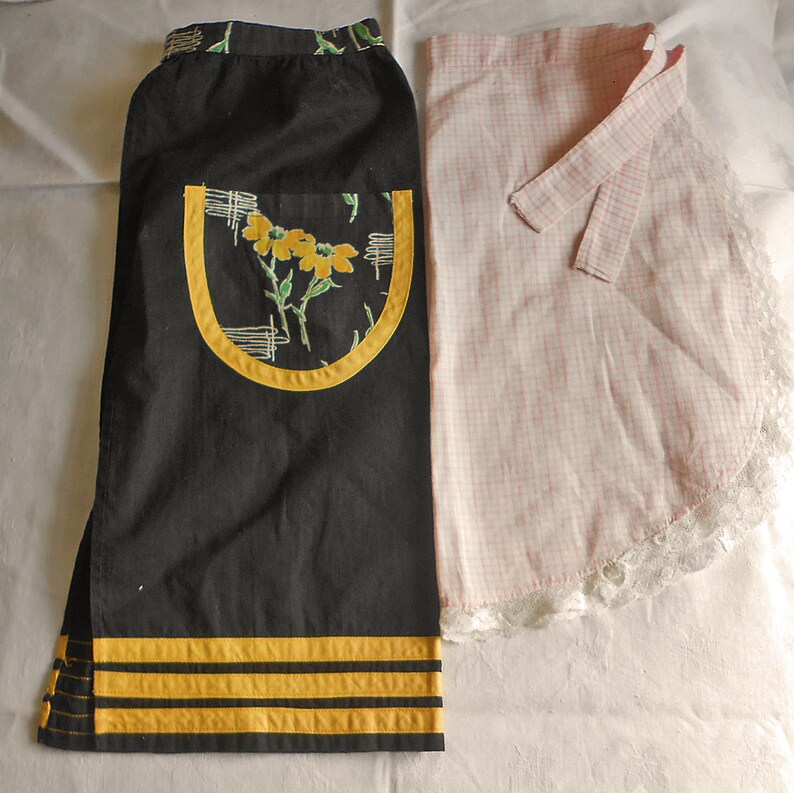 2 CHILDRENS HALF APRONS Buy 1 or Both Hand Sewn Vintage Cotton Yellow Daisy & Bands on Black or Pink Windowpane Lace Trim Ez Care Washable image 1