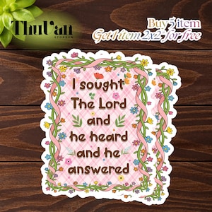 May include: Two floral stickers with the text "I sought The Lord and he heard and he answered" in a decorative font. The stickers have a pink plaid background, floral borders, and pink ribbon accents. The stickers are on a wooden surface.
