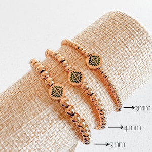 Hmong-huiskralenarmband: gouden roestvrijstalen stretchsieraden