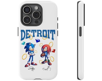 May include: A white iPhone case with a blue and red cartoon image of Sonic the Hedgehog and Knuckles. The case has the word "DETROIT" in blue letters and the characters' signatures.