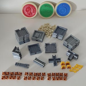 May include: A set of 3D printed game pieces for a tabletop role-playing game. The set includes a variety of shapes and sizes, including walls, doors, and other architectural elements. The pieces are made of a light gray plastic and are designed to be used with a variety of tabletop games.