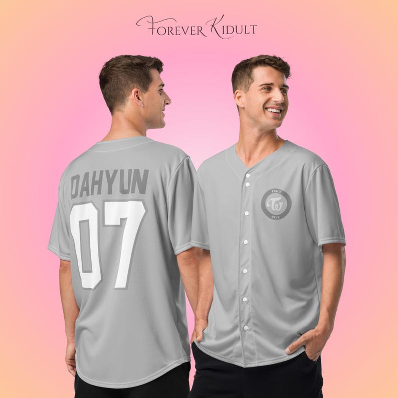 May include: A light gray baseball jersey with the name "DAHYUN" and the number "07" on the back. The front features a circular logo and the text "FOREVER KIDULT". The jersey has short sleeves and a button-up front.