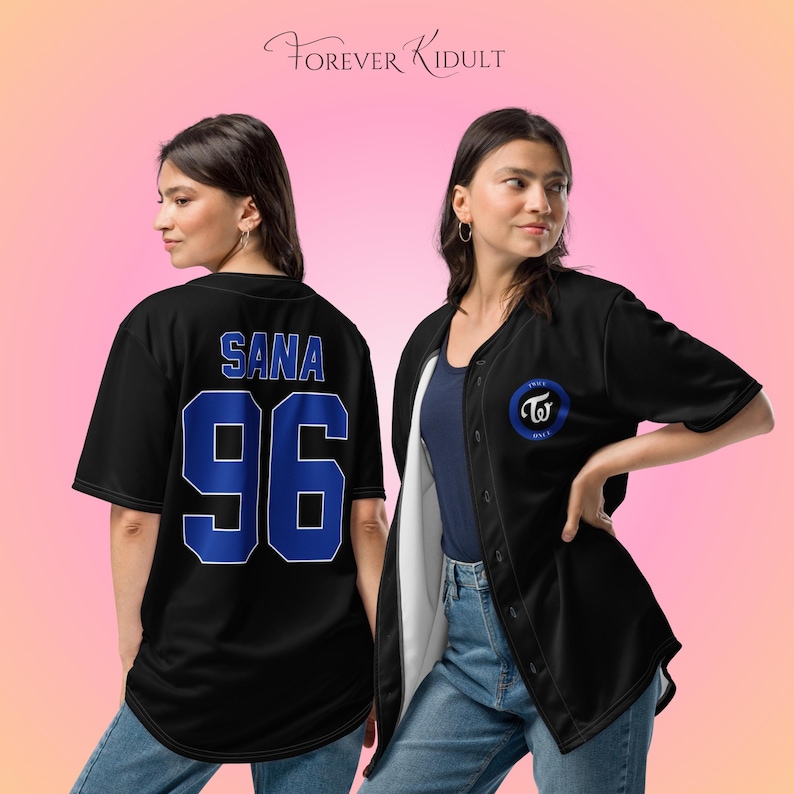 May include: Black baseball jersey with blue detailing. The back of the jersey displays the name "SANA" and the number "96". The front features a blue circular logo with the text "TWICE" and a logo. The text "Forever Kidult" is at the top.