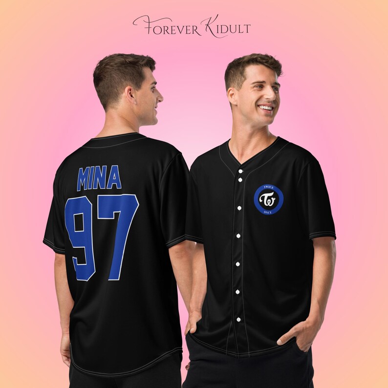 May include: Black baseball jersey with white buttons and a blue and white logo on the chest. The back of the jersey has the name "MINA" and the number "97" in blue. The text "FOREVER KIDULT" is at the top.