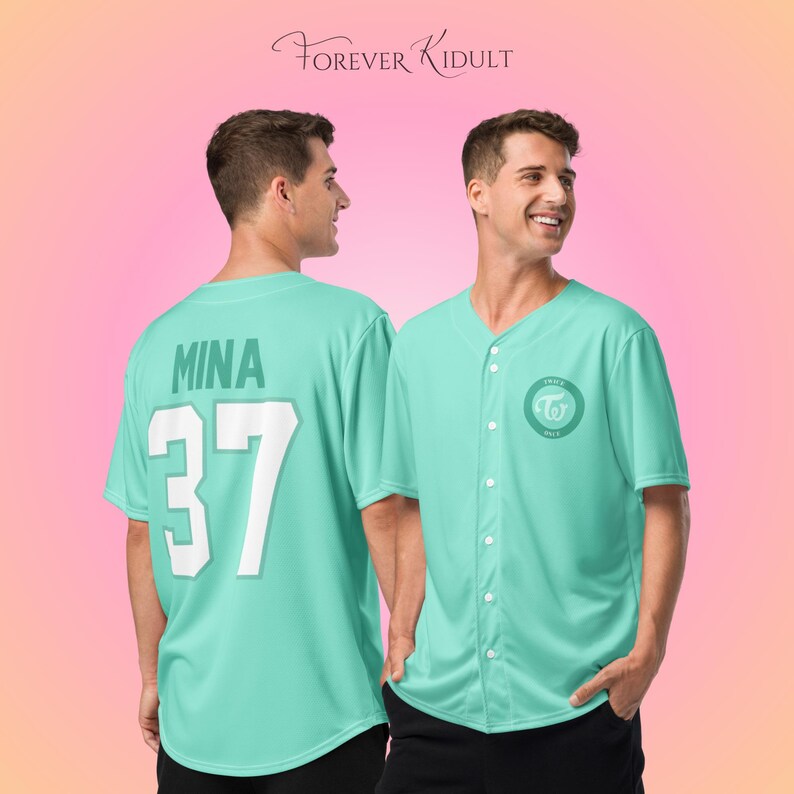 May include: A light teal baseball jersey with the name "MINA" and the number "37" on the back. The front features a circular logo with text. The jersey has a button-up front and short sleeves. The text "FOREVER KIDULT" is at the top.