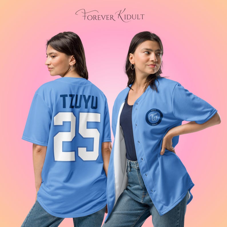 May include: Light blue baseball jersey with the name "TZUYU" and the number "25" on the back. The front of the jersey has a circular logo. The text "FOREVER KIDULT" is at the top. The jersey is worn over a navy blue top and jeans.