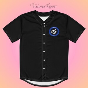 May include: Black baseball jersey with white buttons and a white collar. The jersey features a blue and white circular logo with the text "TWICE" and "ONCE". The text "Forever Kidult" is written in cursive at the top.