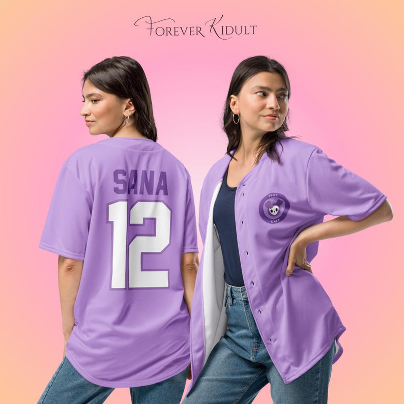 May include: A light purple baseball jersey with the name "SANA" and the number "12" in white on the back. The jersey has a button-up front and a small circular emblem with a skull design. The text "FOREVER KIDULT" is at the top.