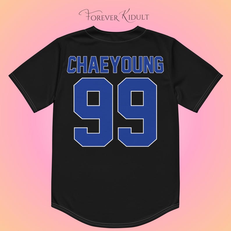 May include: Black baseball jersey featuring the name "CHAEYOUNG" in blue lettering and the number "99" in blue with a white outline. The jersey has a rounded hemline and short sleeves. The brand name "Forever Kidult" is at the top.