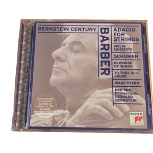 May include: A CD case featuring the album "Bernstein Century" with music by Barber, Schumann, and others. The cover art includes a portrait of a man and the text "Adagio for Strings." The CD is a Sony Classical release.