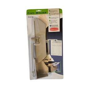 May include: A beige copy holder in its original packaging. The packaging is green and white, with the words "COPY HOLDER" and "#6250" printed on it. The copy holder is designed to hold documents for easy viewing.