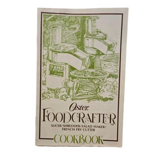 May include: A vintage Oster FoodCrafter cookbook with a green and white illustration of a food processor. The cover features the Oster logo and the words "FoodCrafter" and "Cookbook". The cookbook is for a slicer, shredder, salad maker, and French fry cutter.