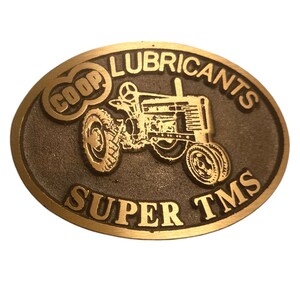 John Deere Tractor Belt Buckle Vintage COOP Model H  Lubricants Super TMS Collectible