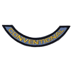 May include: A curved patch with the word "CONVENTIONAL" embroidered in gold thread on a light blue background. The patch has a black border and is likely an emblem or insignia.