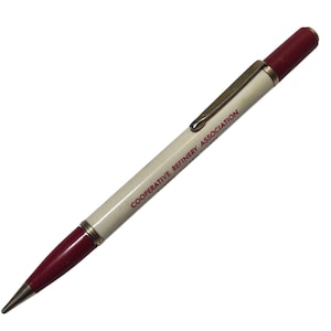 May include: A vintage pen with a white barrel and burgundy accents. The pen features the text "COOPERATIVE REFINERY ASSOCIATION" in red. A gold-colored clip and trim complete the design. The pen is a classic writing instrument.