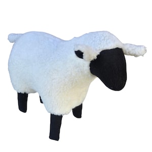 May include: A white ceramic mug with a black handle and the text "But First, Coffee" in a black, bold font. The mug is on a white surface. The mug is 4 inches tall.