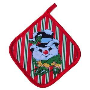 May include: A red and white striped Christmas potholder with a snowman design. The snowman has a black top hat, a red nose, and a green scarf. The potholder has a red border and a loop for hanging.