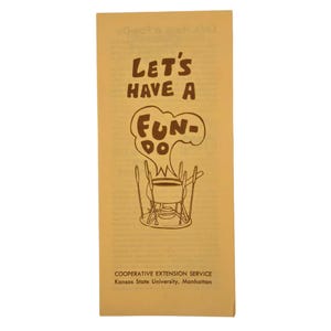 May include: A yellow pamphlet with the text "Let's Have A Fun-Do" in brown lettering. The pamphlet features a cartoon illustration of a fondue pot with forks and a speech bubble that says "Fun-Do". The pamphlet is from the Cooperative Extension Service, Kansas State University, Manhattan.